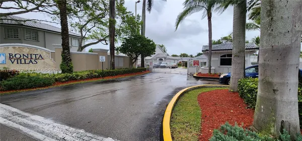 an aerial view of a house with a garden and swimming pool