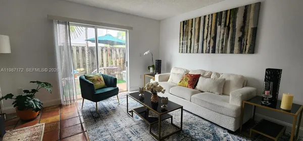 a living room with furniture and a window