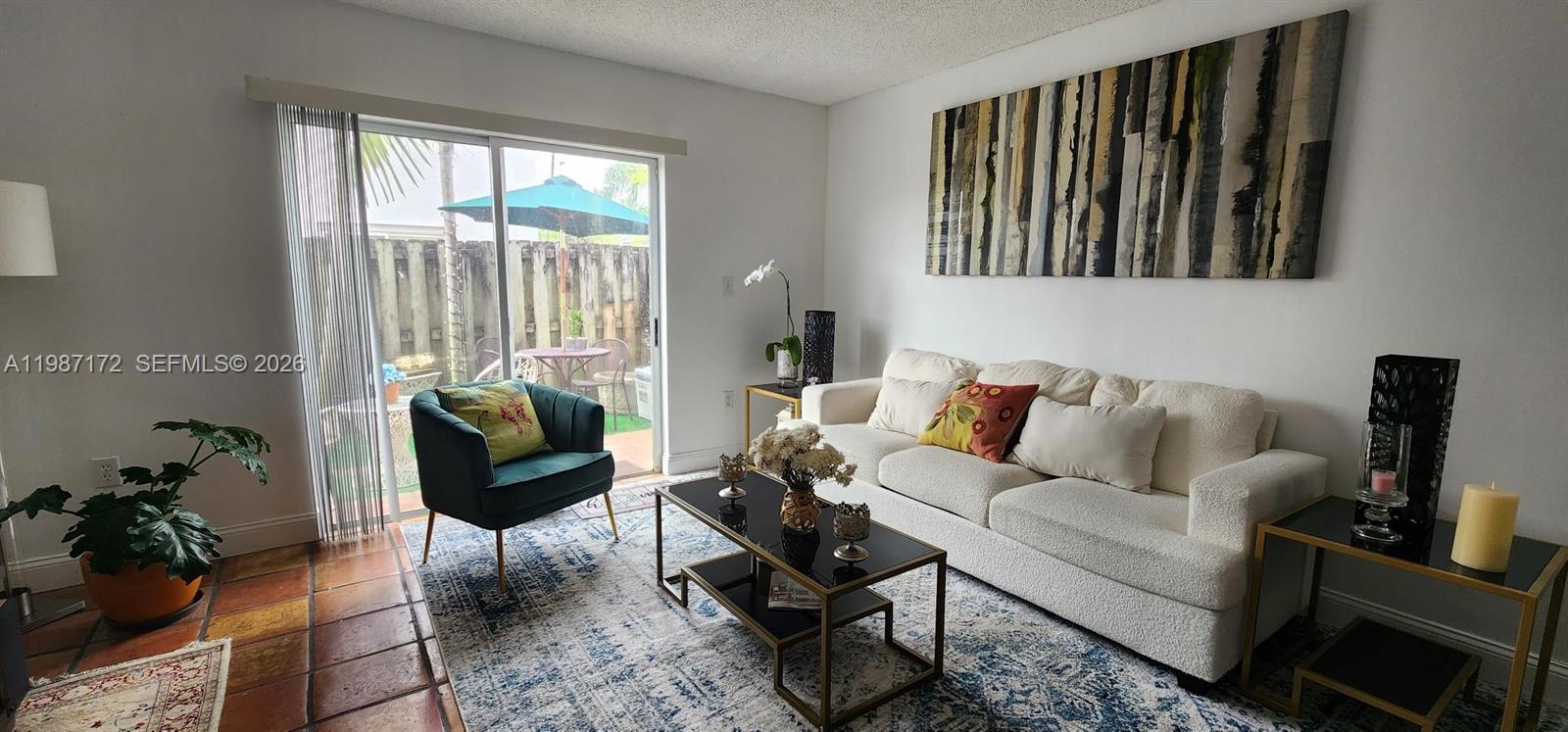14133 Southwest 121st Place, Unit 9 Miami, FL 33186 - Photo 7 of 20 a living room with furniture and a window