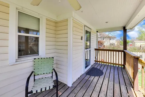 a view of a balcony with wooden floor