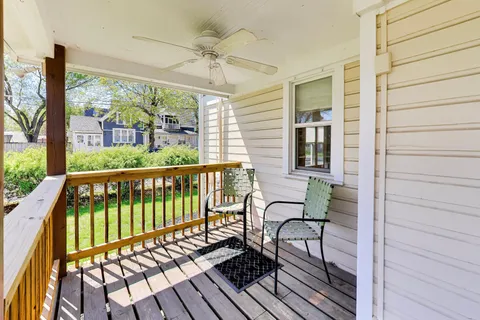 a view of a balcony with furniture