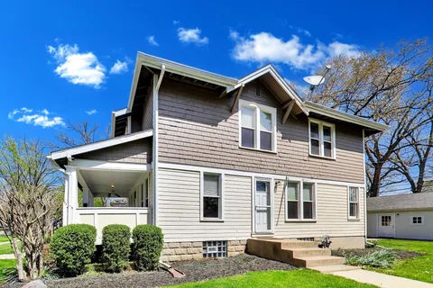 a front view of a house with a deck