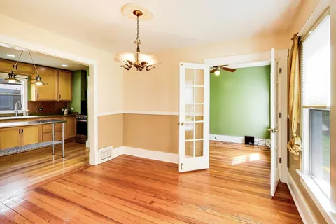 a view of a kitchen from the hallway