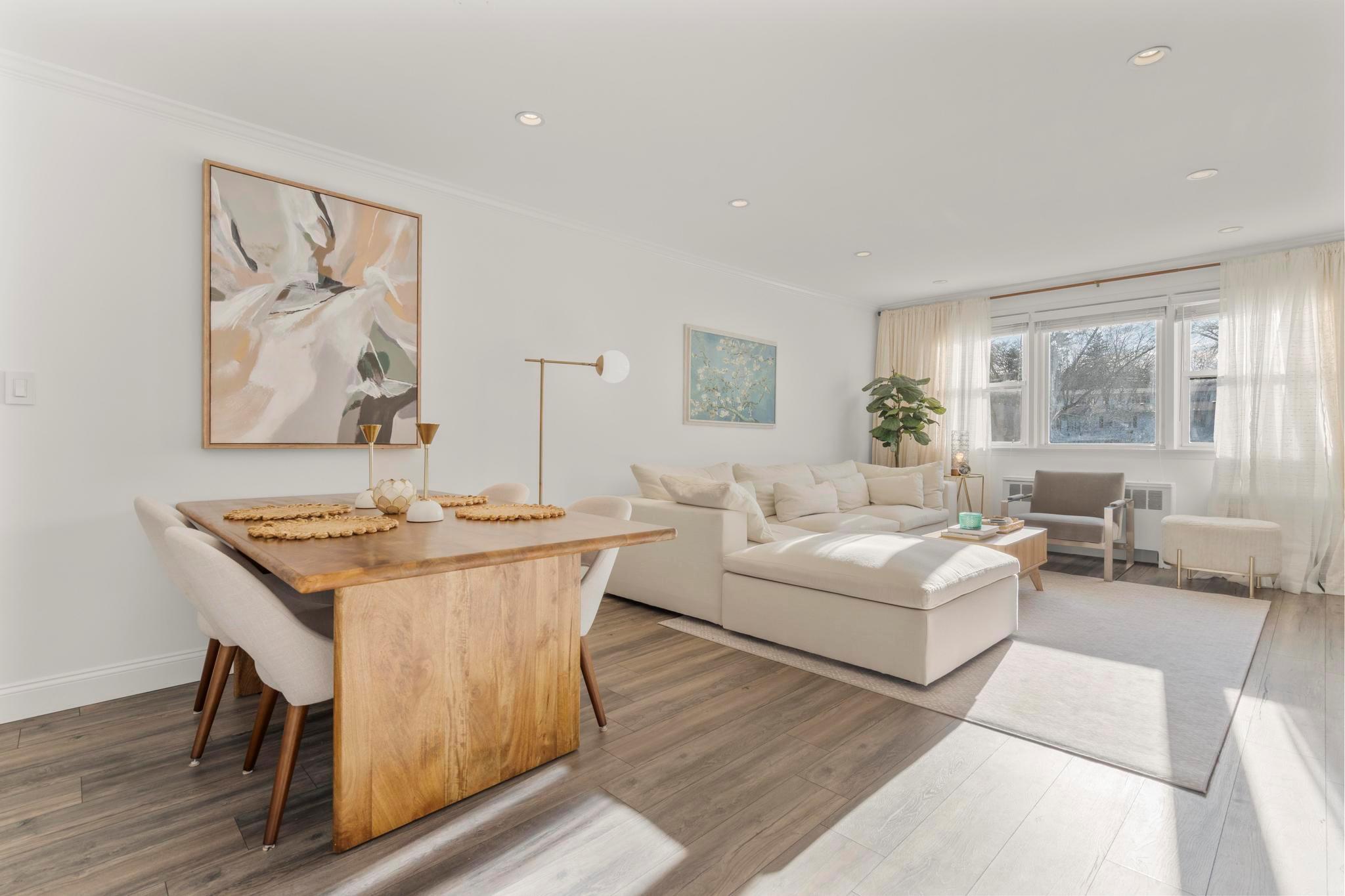 55 Avon Circle, Unit D Rye Brook, NY 10573 - Photo 1 of 1 a living room with furniture and a table