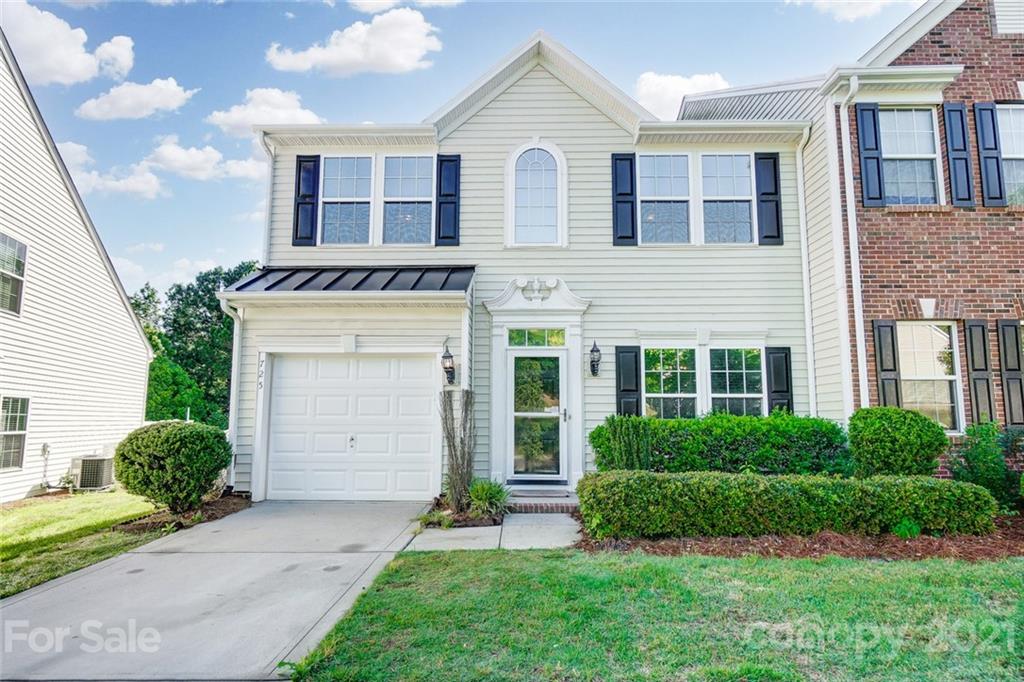 725 Prospect Lane Fort Mill, SC 29708 - Photo 1 of 26 a view of a house with a yard and plants