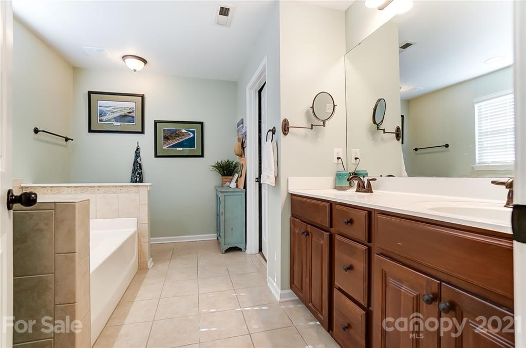 725 Prospect Lane Fort Mill, SC 29708 - Photo 17 of 26 a spacious bathroom with a double vanity sink mirror and bathtub