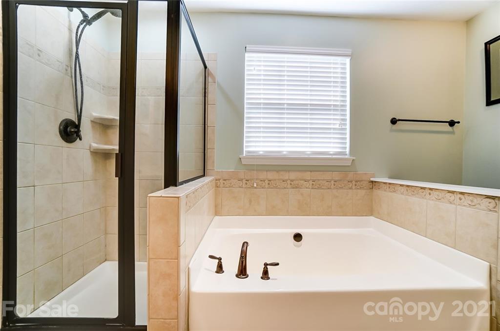 725 Prospect Lane Fort Mill, SC 29708 - Photo 18 of 26 a bathroom with a bathtub and a shower