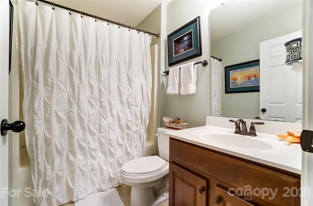 725 Prospect Lane Fort Mill, SC 29708 - Photo 20 of 26 a bathroom with a sink a toilet and shower curtain