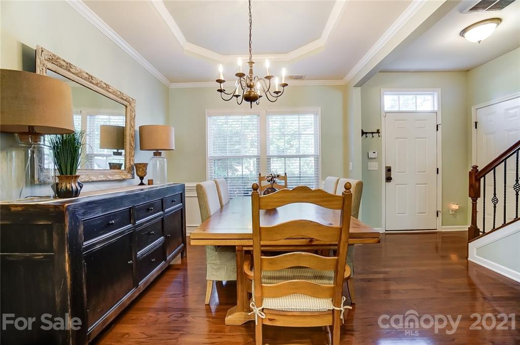 725 Prospect Lane Fort Mill, SC 29708 - Photo 3 of 26 a view of a dining room with furniture and wooden floor