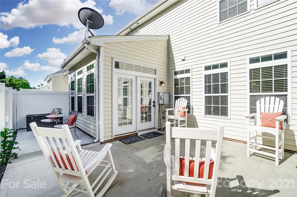 725 Prospect Lane Fort Mill, SC 29708 - Photo 24 of 26 a view of a chairs and table in the back yard of the house