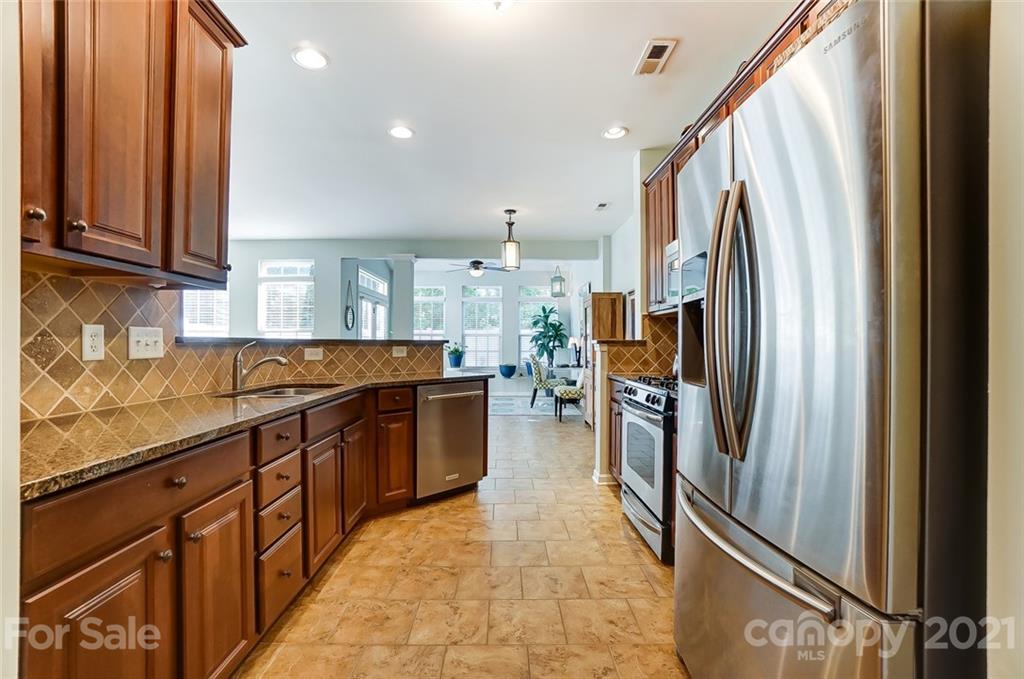 725 Prospect Lane Fort Mill, SC 29708 - Photo 7 of 26 a kitchen with stainless steel appliances granite countertop a refrigerator and a sink
