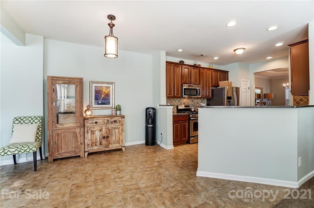 725 Prospect Lane Fort Mill, SC 29708 - Photo 8 of 26 a view of a kitchen with fridge and workspace