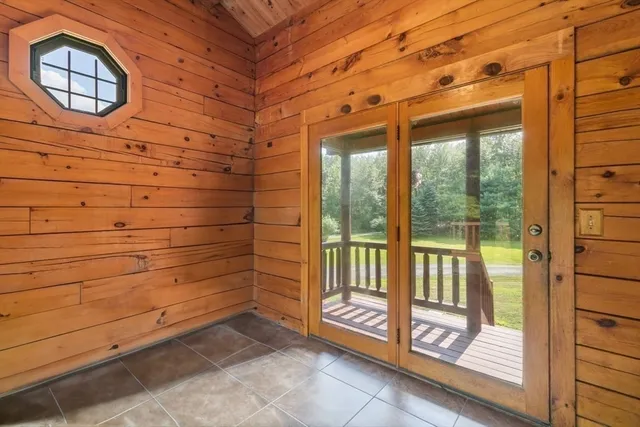 a view of a brick house with a large window