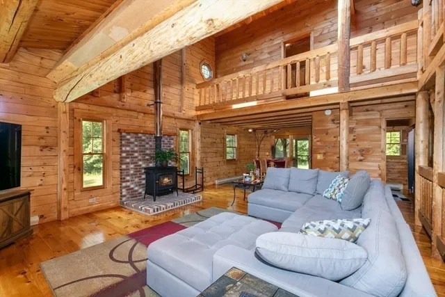 a outdoor living space with patio furniture and a fireplace