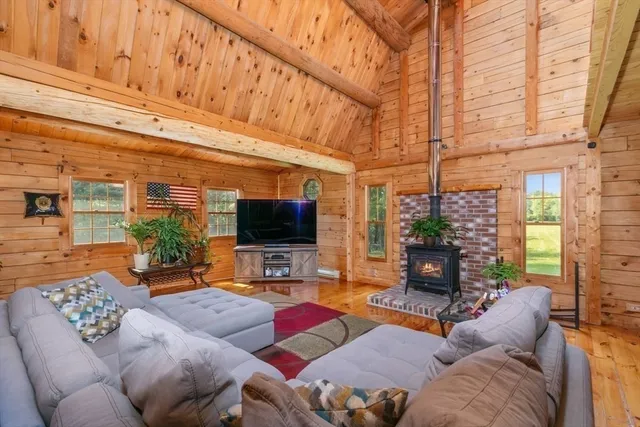 a bedroom with a bed and a mirror