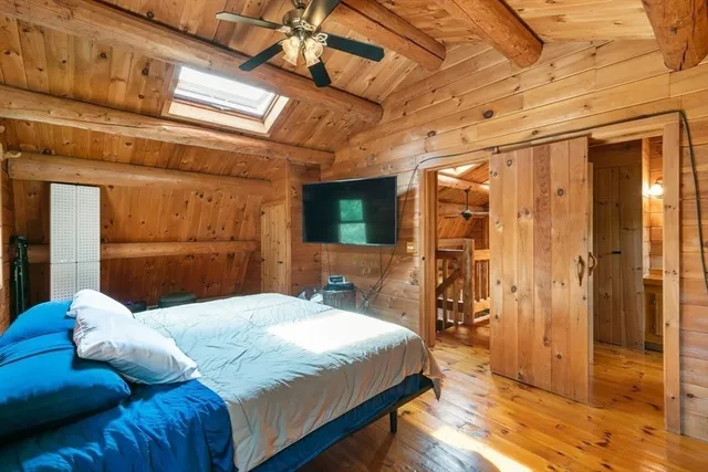 a bathroom with a sink a toilet and shower curtain