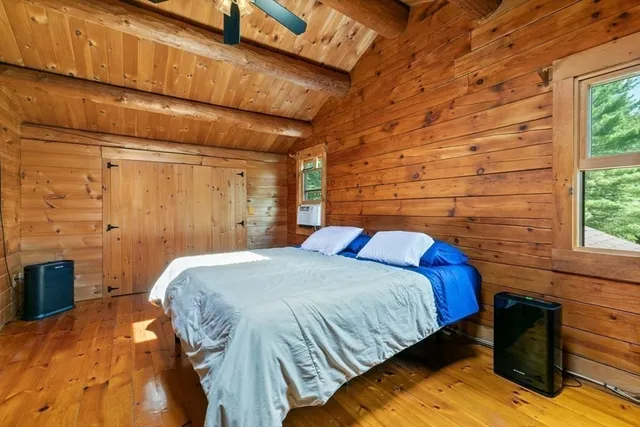 a bedroom with a bed and a cabinets