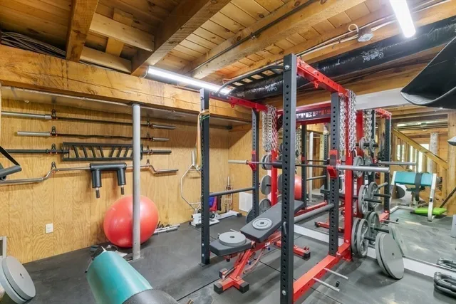 a bedroom with furniture and a fireplace