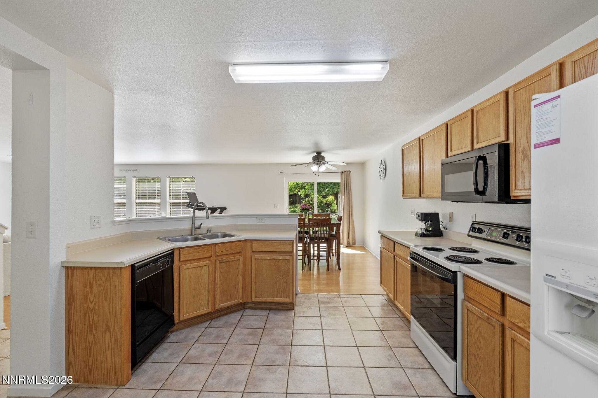 9490 Autumn Leaf Way Reno, NV 89506 - Photo 11 of 31 kitchen looking towards back yard