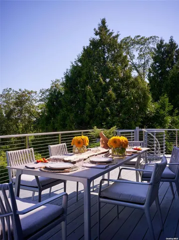a dining room with a table and chairs