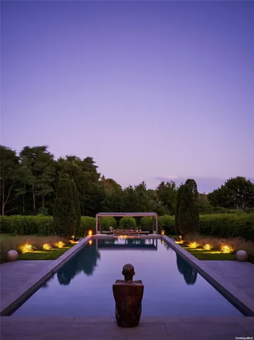 a view of a swimming pool with a table and chairs