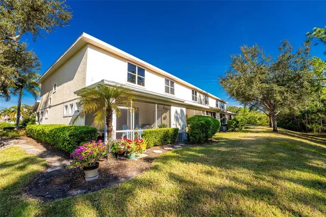 a view of spacious bedroom with a bed and a large window