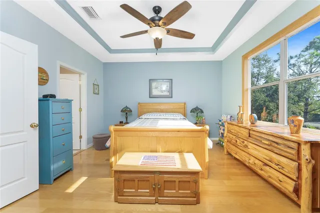 a bathroom with a granite countertop sink mirror and vanity