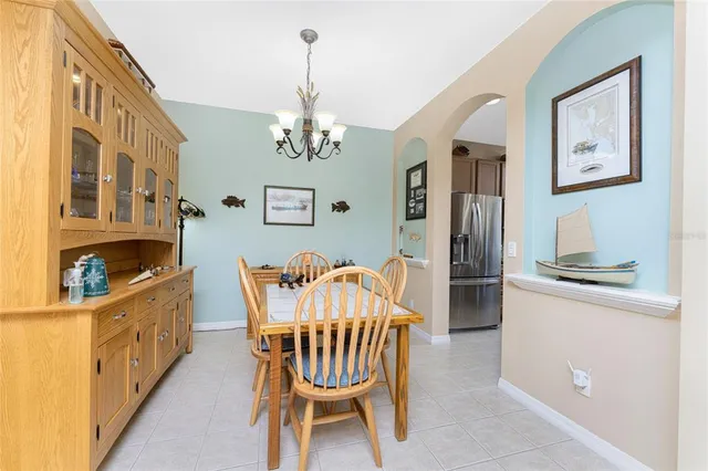 a kitchen with stainless steel appliances granite countertop a sink a stove a microwave a sink a refrigerator and cabinets