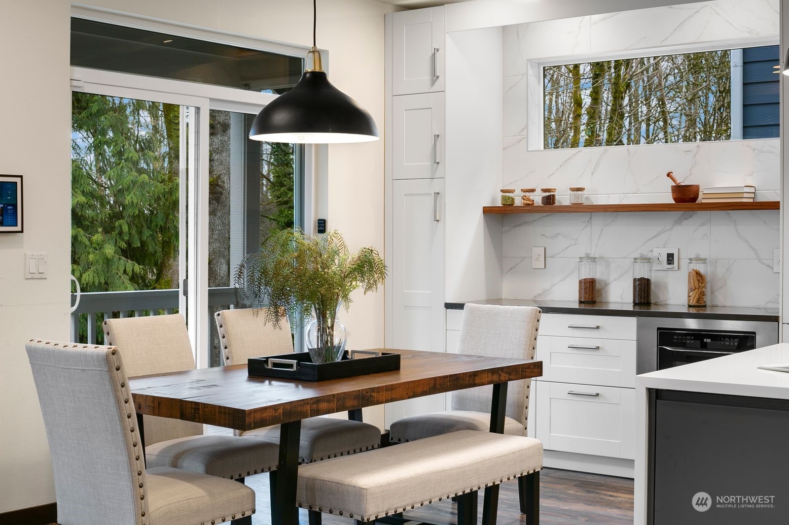 17605 3rd Avenue Southeast Bothell, WA 98012 - Photo 13 of 38 a kitchen with a stove a table and chairs in it