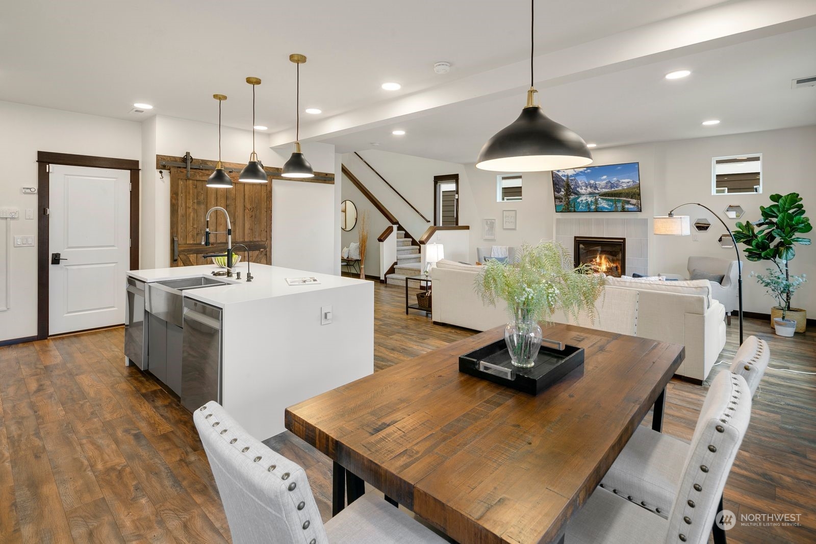 17605 3rd Avenue Southeast Bothell, WA 98012 - Photo 15 of 38 a kitchen with kitchen island a white counter top space a sink and living room view