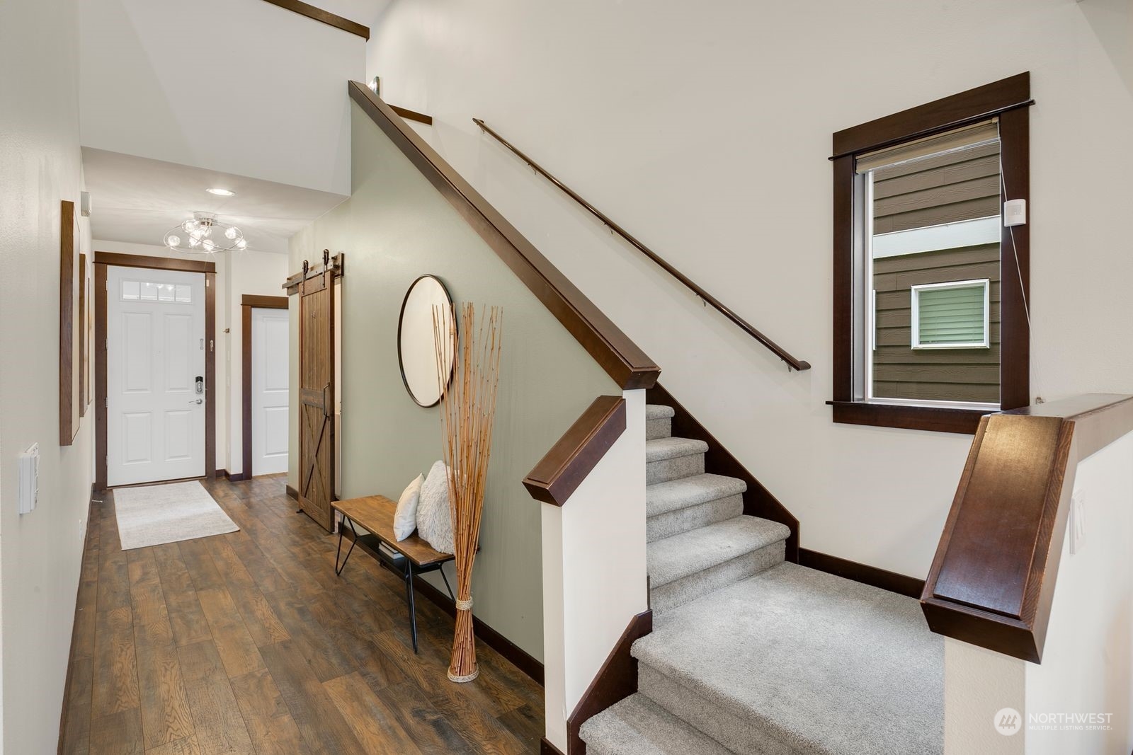 17605 3rd Avenue Southeast Bothell, WA 98012 - Photo 16 of 38 a view of a hallway with entryway wooden floor and couches
