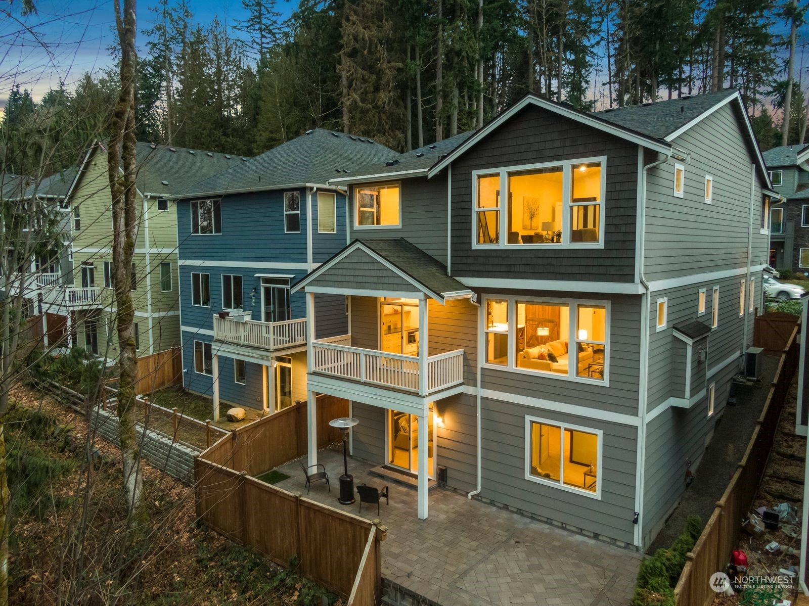 17605 3rd Avenue Southeast Bothell, WA 98012 - Photo 37 of 38 a view of a brick house with large windows and a small yard