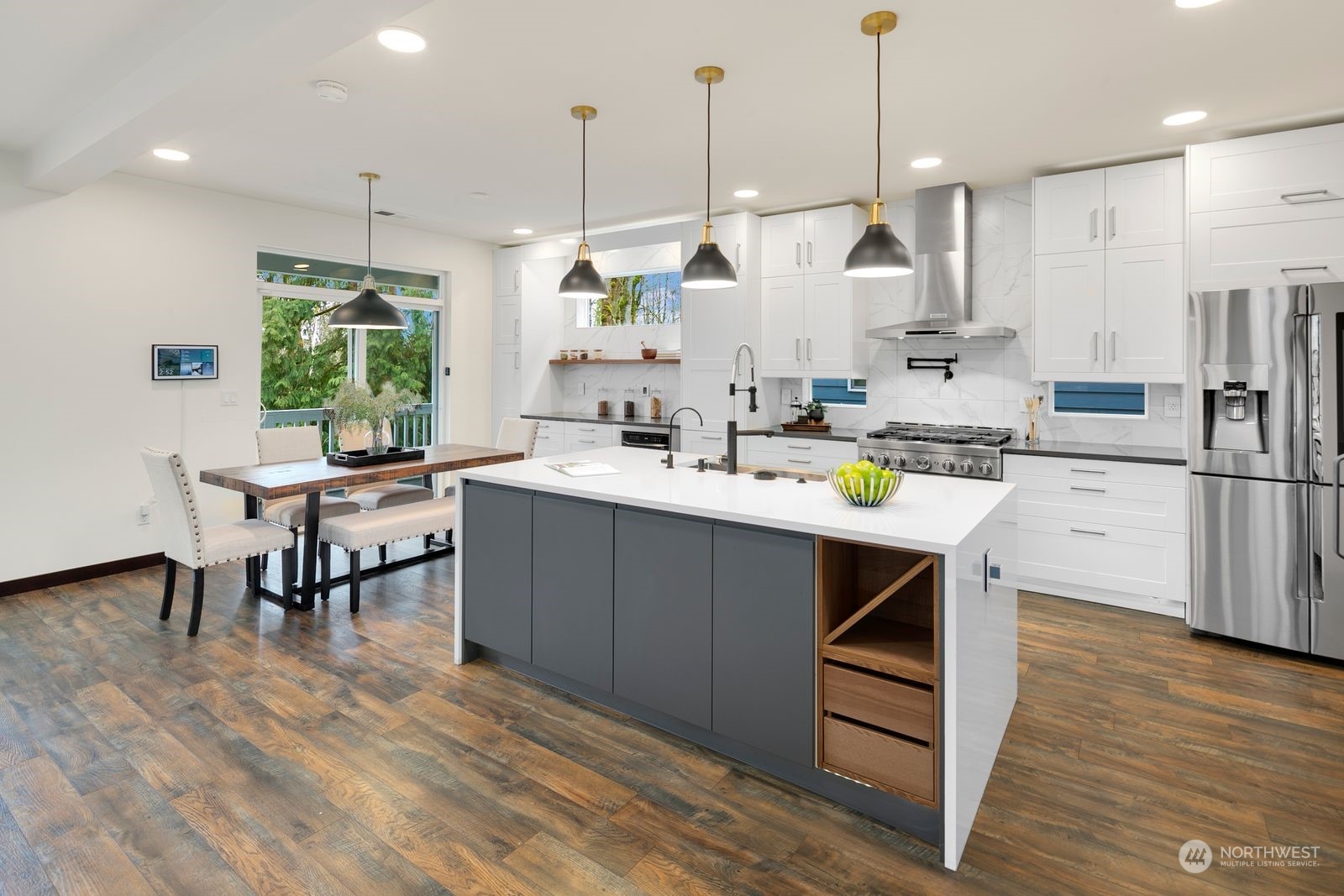17605 3rd Avenue Southeast Bothell, WA 98012 - Photo 8 of 38 a kitchen with a sink a counter top stainless steel appliances and cabinets