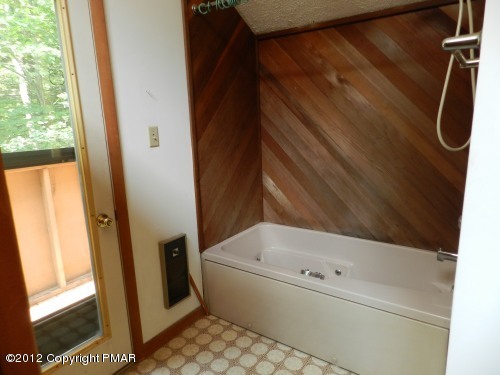 734 Decker Road Bushkill, PA 18324 - Photo 11 of 18 a bathroom with a bathtub and a shower
