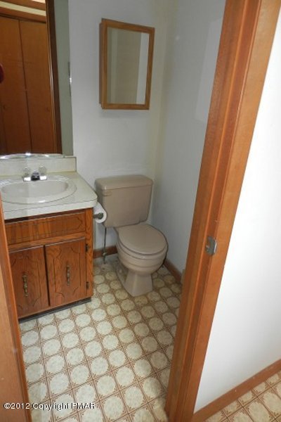 734 Decker Road Bushkill, PA 18324 - Photo 13 of 18 a bathroom with a granite countertop toilet and a sink