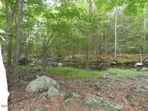 734 Decker Road Bushkill, PA 18324 - Photo 17 of 18 a view of outdoor space with green field and trees