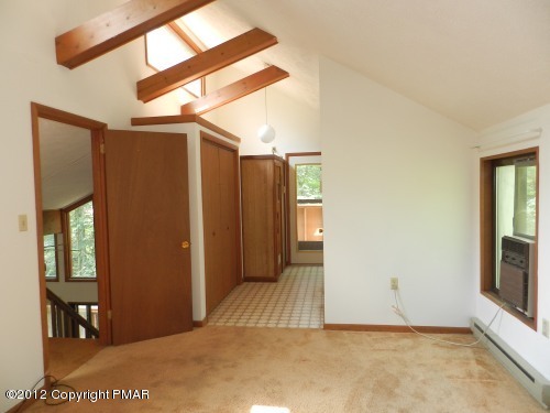 734 Decker Road Bushkill, PA 18324 - Photo 10 of 18 a view of a room with wooden floor and windows