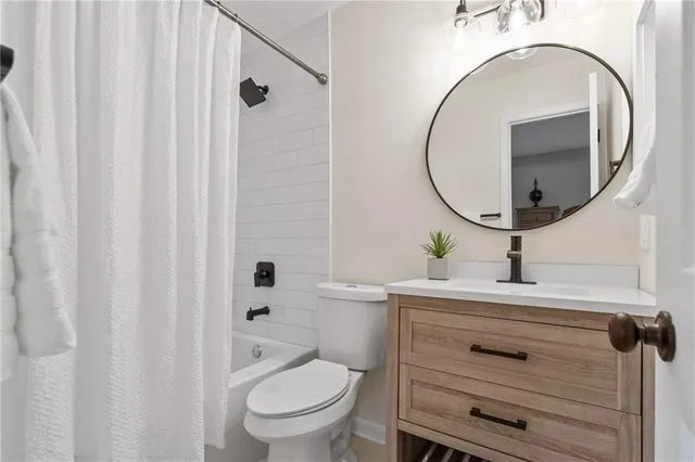 a utility room with sink dryer and washer