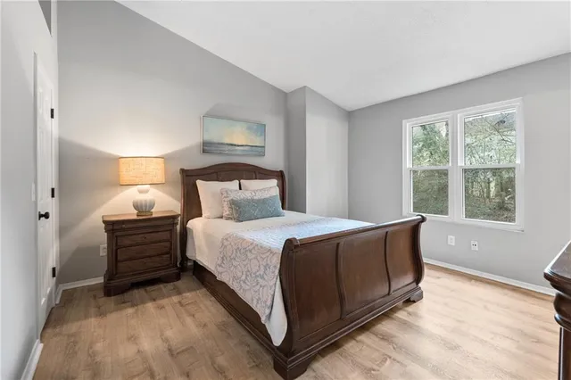 a bathroom with a sink vanity mirror and toilet