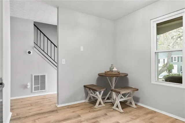 a kitchen with stainless steel appliances granite countertop a sink stove and microwave