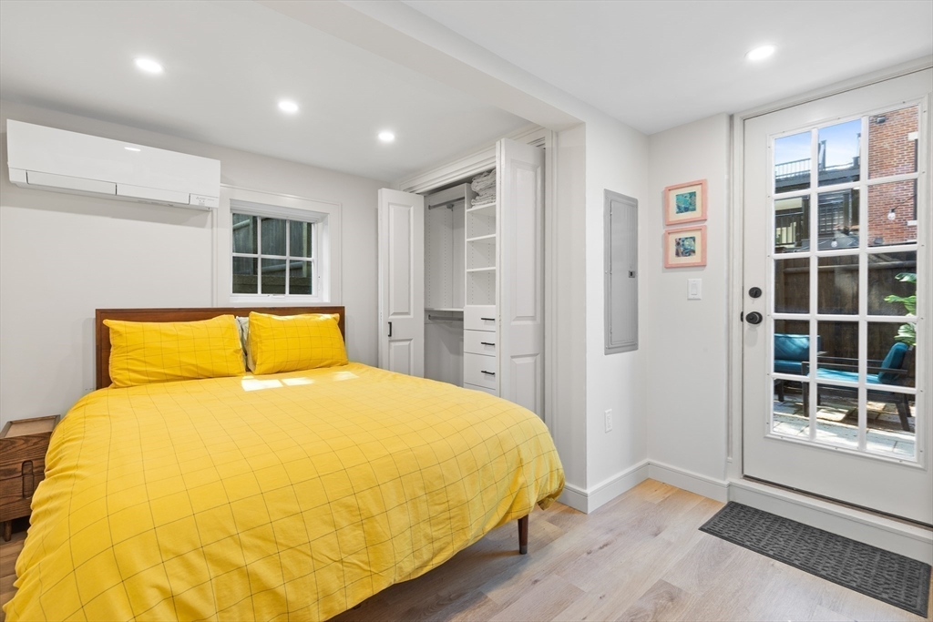 46 Lancaster Terrace, Unit 46 Brookline, MA 02446 - Photo 12 of 25 a large bed sitting in a bedroom next to a window