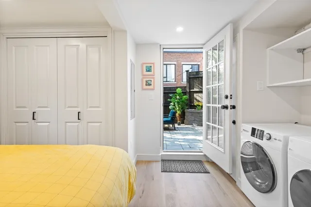 a bathroom with a sink a washer and dryer