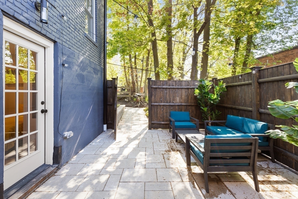 46 Lancaster Terrace, Unit 46 Brookline, MA 02446 - Photo 18 of 25 a view of a backyard with sitting area