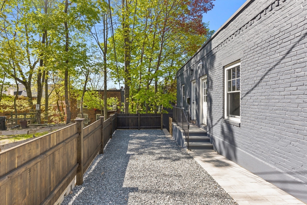 46 Lancaster Terrace, Unit 46 Brookline, MA 02446 - Photo 23 of 25 a view of a porch with wooden floor and bench