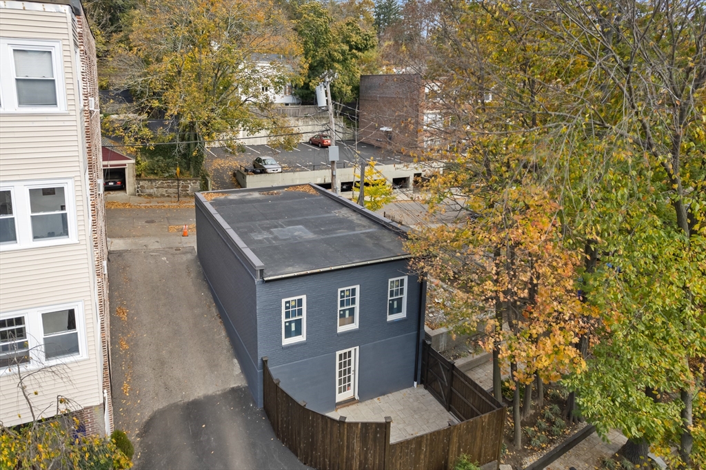 46 Lancaster Terrace, Unit 46 Brookline, MA 02446 - Photo 25 of 25 a view of a house with brick wall and roof