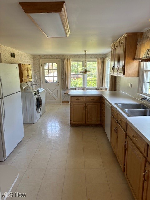 3620 Rambo Avenue Alliance, OH 44601 - Photo 5 of 14 Kitchen with fridge, dishwashing machine, independent washer and dryer, sink, and kitchen peninsula