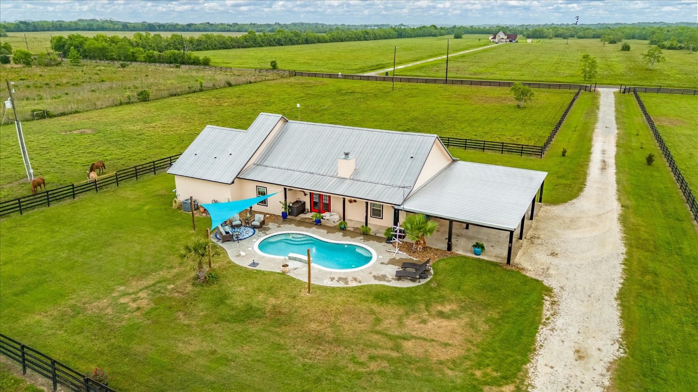 a view of a swimming pool with a patio