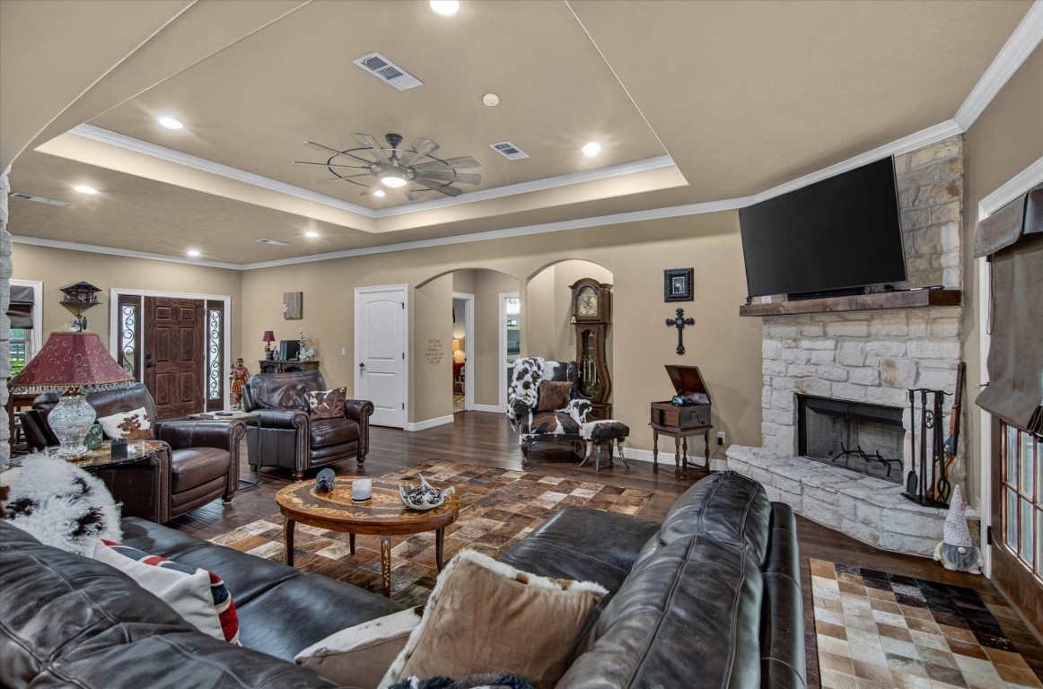 1755 McBride-Devillier Loop Winnie, TX 77665 - Photo 11 of 44 a living room with furniture fireplace and a flat screen tv
