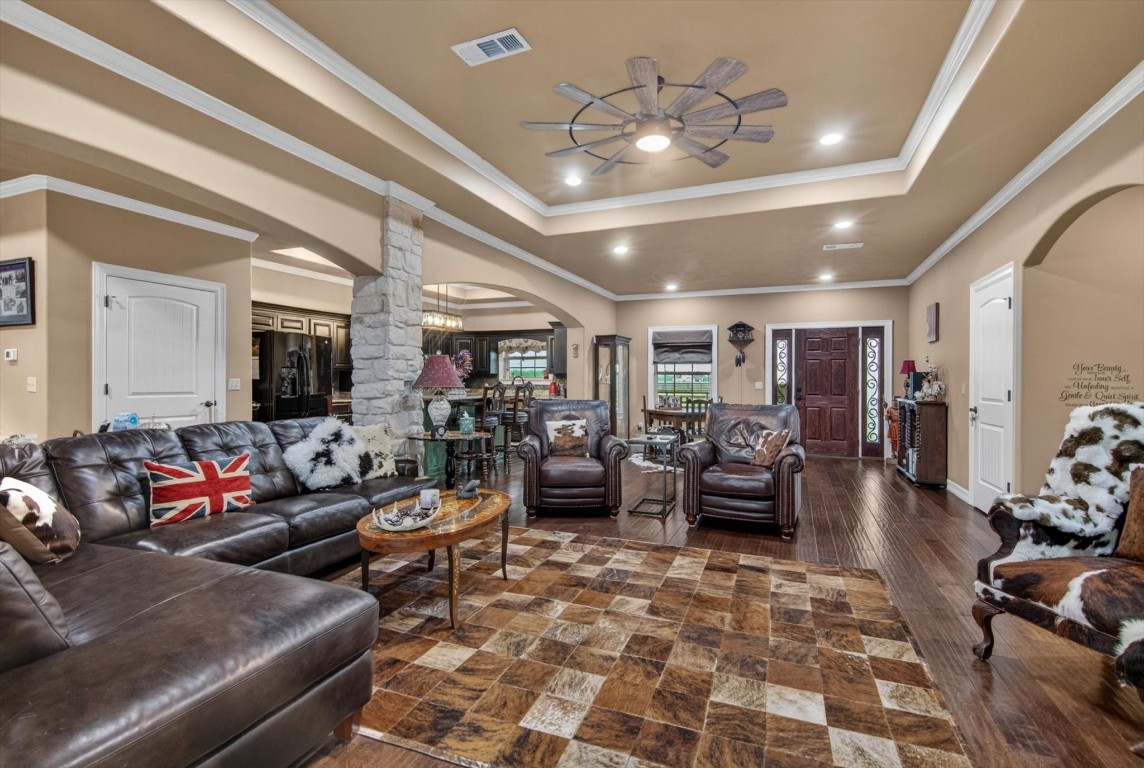 1755 McBride-Devillier Loop Winnie, TX 77665 - Photo 13 of 44 a living room with furniture and a chandelier