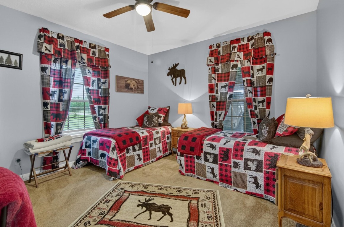 1755 McBride-Devillier Loop Winnie, TX 77665 - Photo 25 of 44 a bedroom with bed and a window